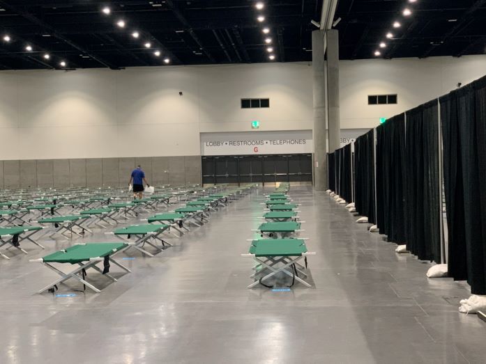 Cots in a row with a curtain dividing the room