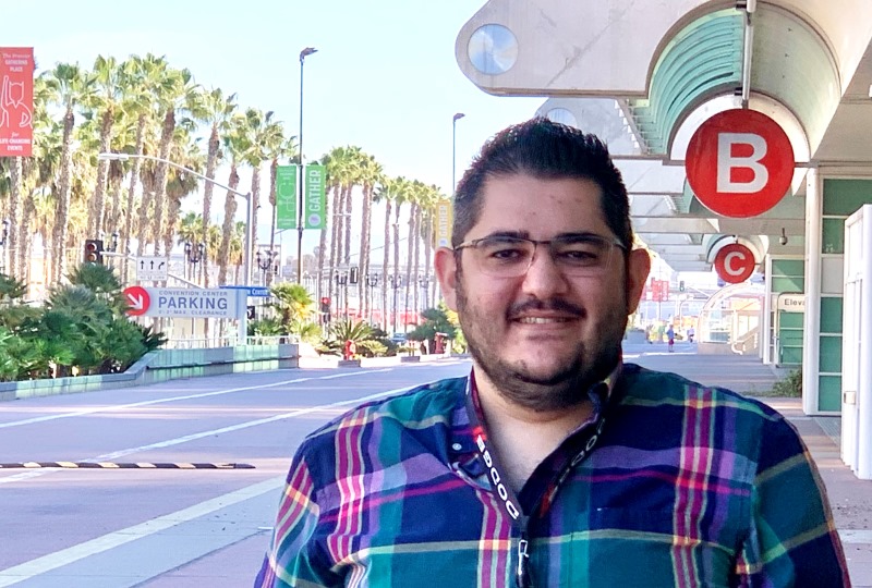 Mansour Shammas standing in front of the San Diego Convention Center