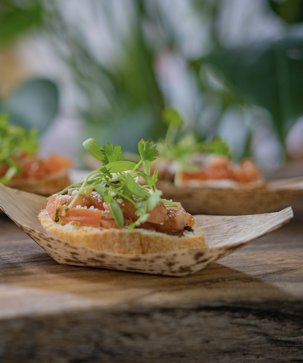 Small toast served on a sustainable, bamboo-based plate at the San Diego Convention Center.