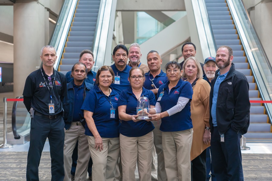 Build a Career: Convention Center Employees show off the award given to them by the San Diego Regional Task Force on Homelessness for their work during Operation Shelter to Home.