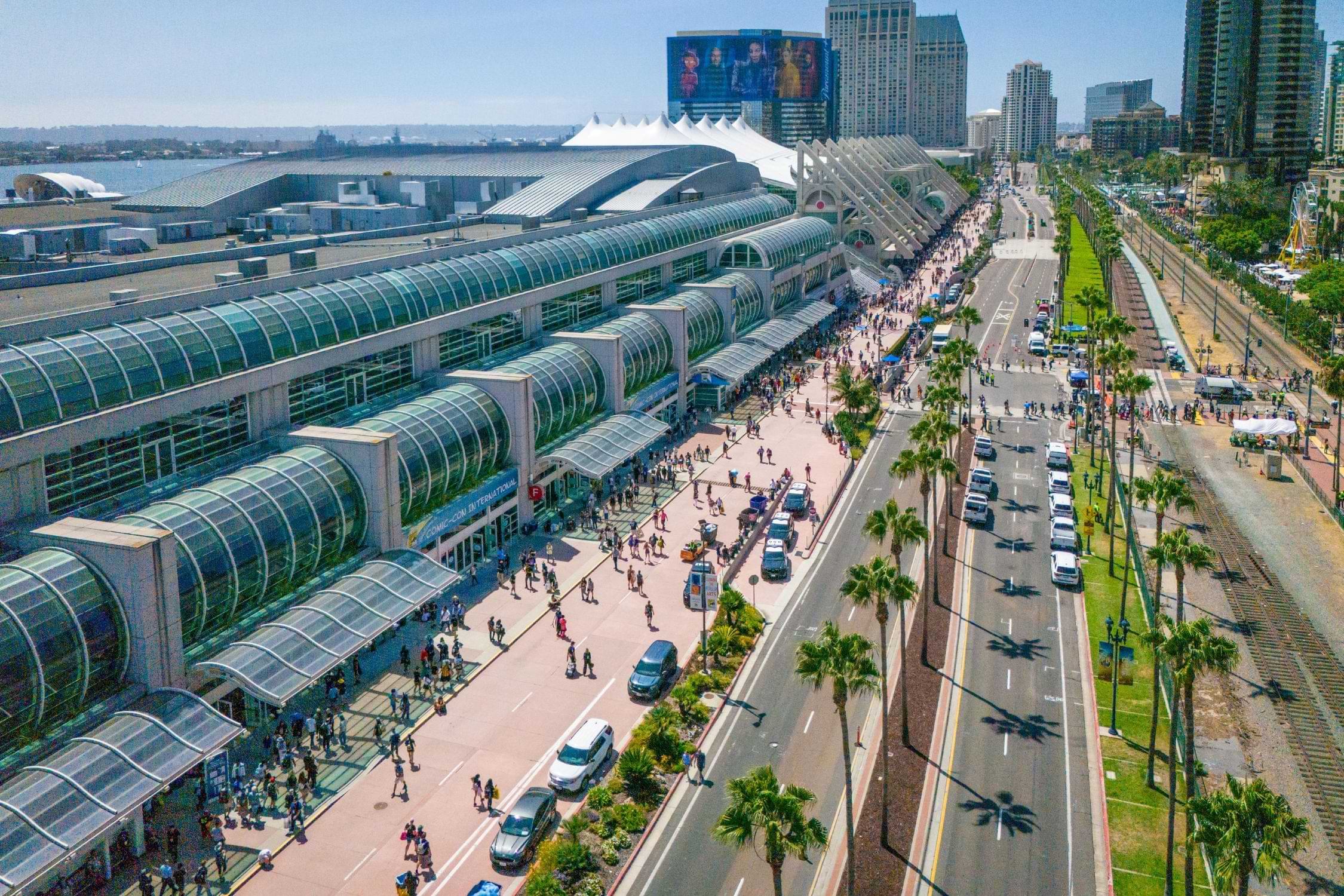 Exterior Image of the San Diego Convention Center building, Harbor Drive, and event attendees during Comic-Con.